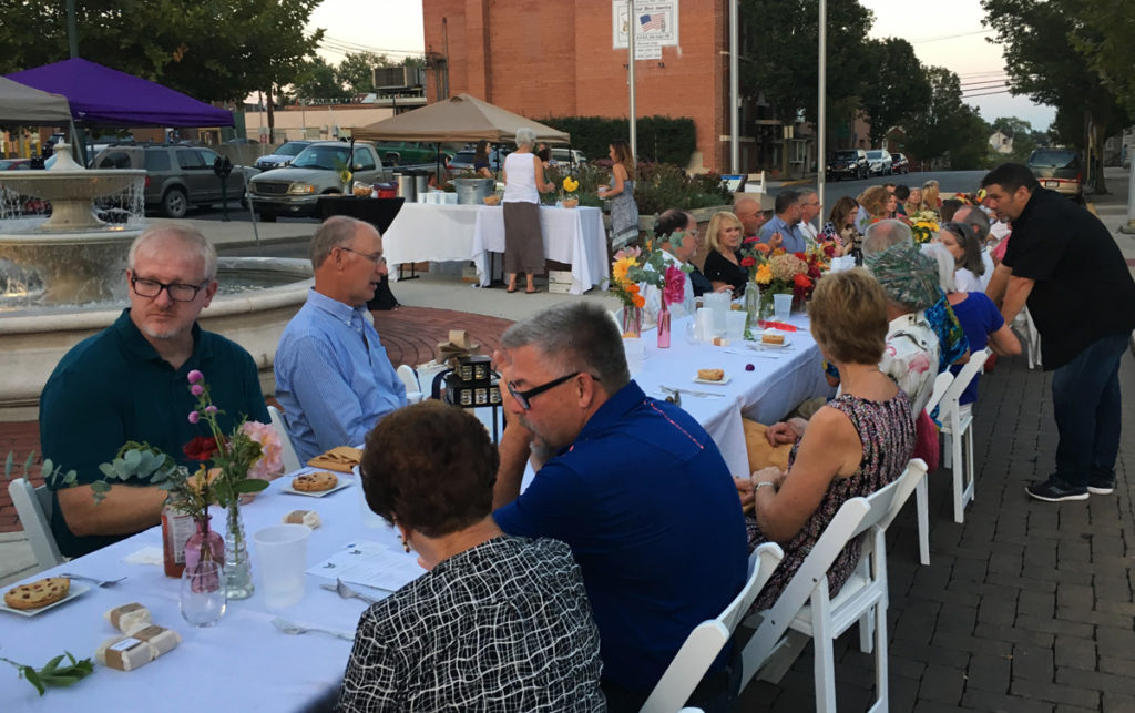 People enjoying their meals during inaugural Martinsburg Farmers Market Farm to Fork 2017 