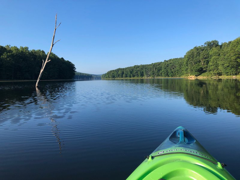 Calm water as James' kayaks on Sleepy Creek in West Virginia. 